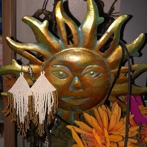 Gold and white dangling earrings